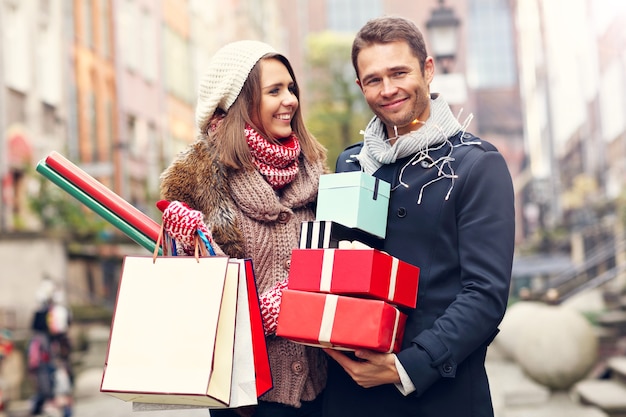 young couple doing Christmas shopping in the city