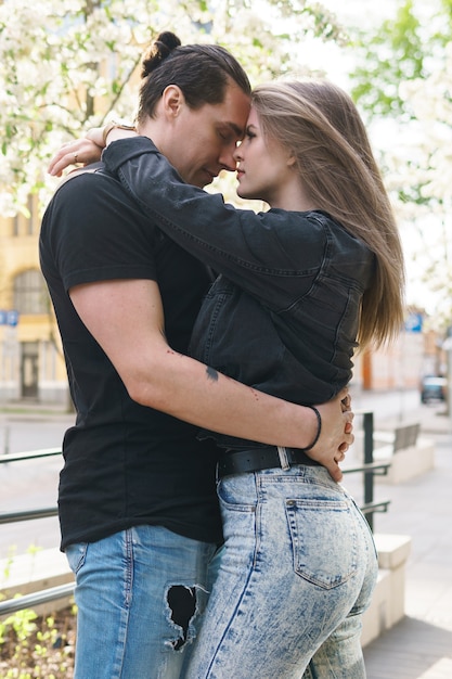 Young couple in embrace during a date outdoors