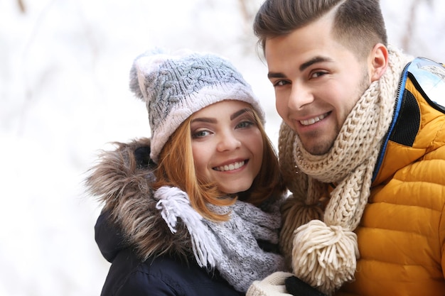 Young couple embracing outdoors in winter