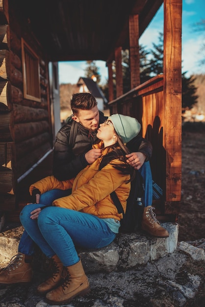 a young couple enjoying a beautiful cottage in nature