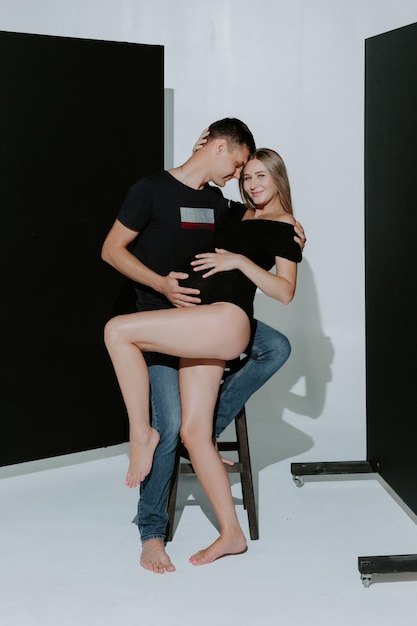 Young couple expecting baby standing together