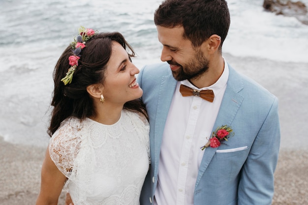 Young couple having a beach wedding