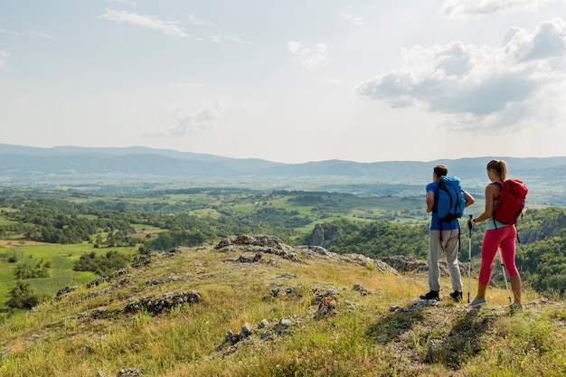 Young couple hiking on the mountain