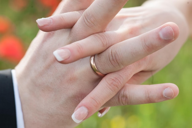 Young couple holding hands tightly