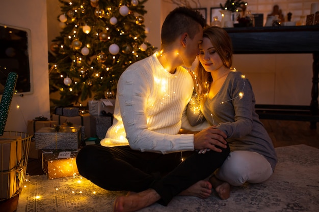 Young couple hugging in Christmas time