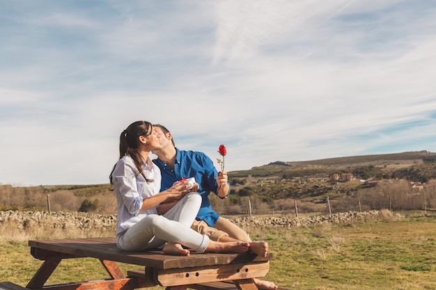 Young couple hugging and enjoying spending time together in the countryside