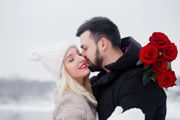 Young couple hugs, congratulating each other on Valentine's Day.