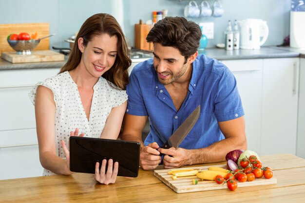 Young couple looking at digital tablet