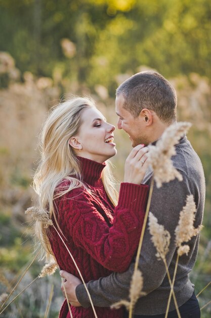 A young couple in love embracing against the background of reeds 1362