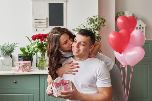 Young couple in love at home celebrating Valentine's Day