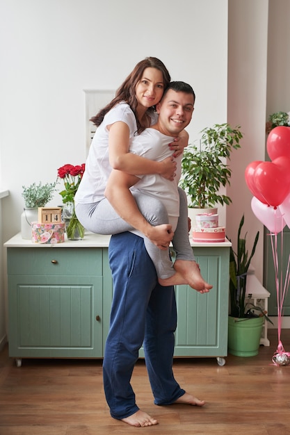 Young couple in love at home celebrating Valentine's Day