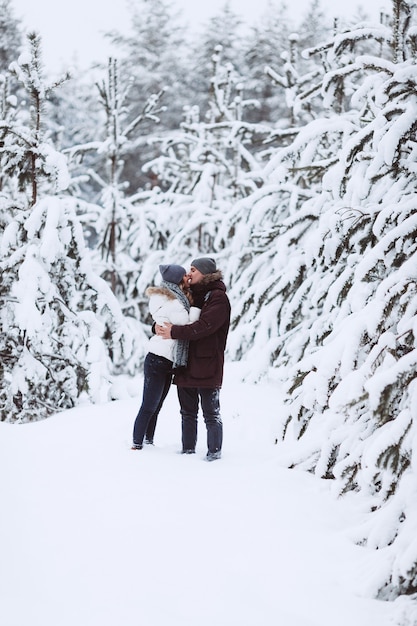 Young couple in love outdoor snowy winter