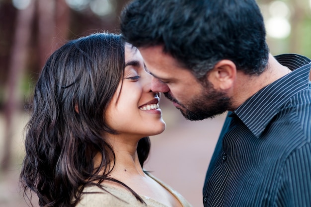 young couple in love relaxed together outdoors on the forest.