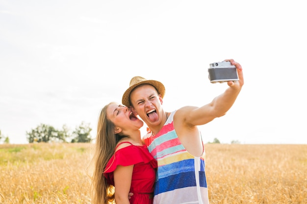 Young couple in love taking selfie outdoors