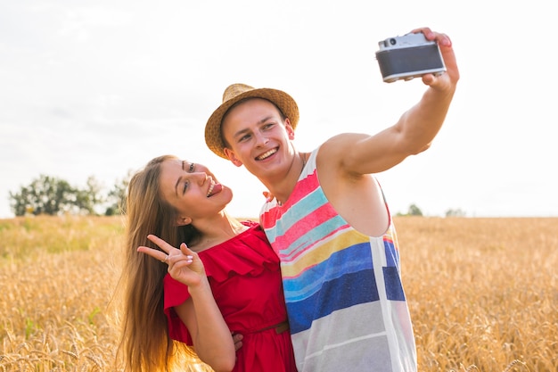 Young couple in love taking selfie outdoors