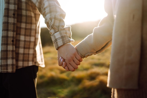 Young couple in love walking in the park on a autumn day Enjoying time together