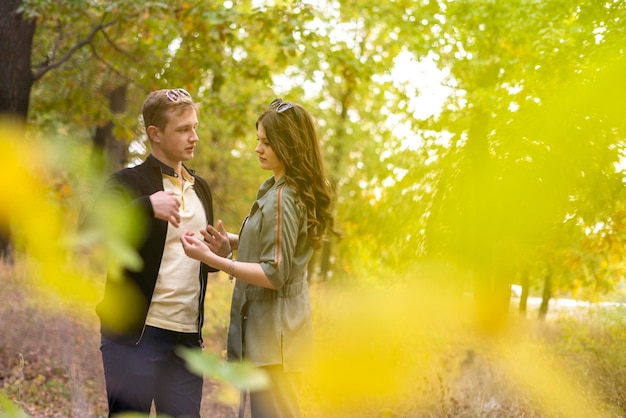 a young couple of male and female walking outdoor and dancing, lifestyle candid