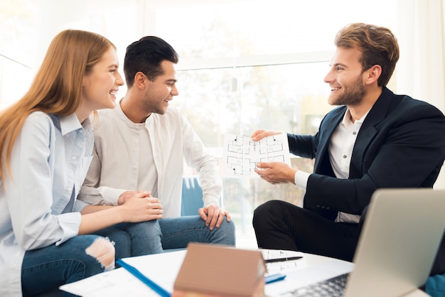 Young couple in a meeting with a realtor.