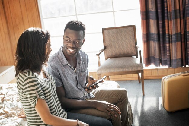 A young couple in a motel room