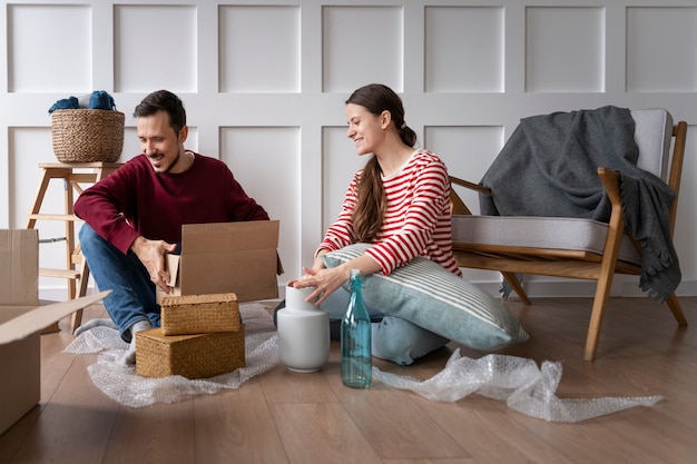 Young couple moving into a new home