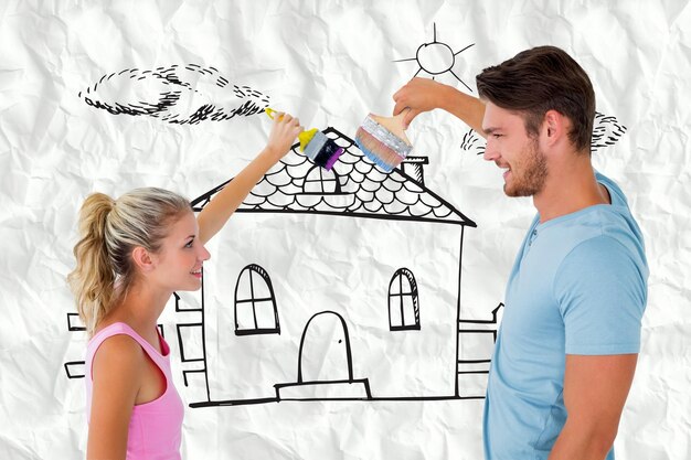 Photo young couple painting with brushes against crumpled white page