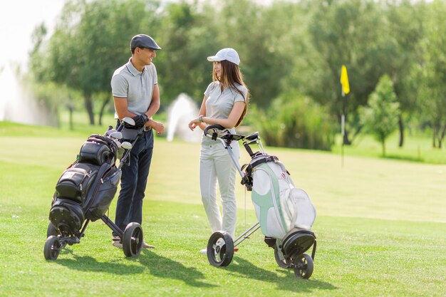 Young couple playing golf