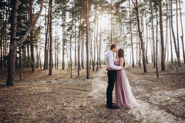 a young couple posing in nature