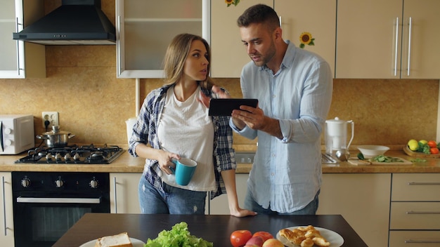 Young couple quarrels in the kitchen at home