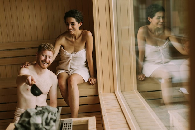 Young couple relaxing in the sauna