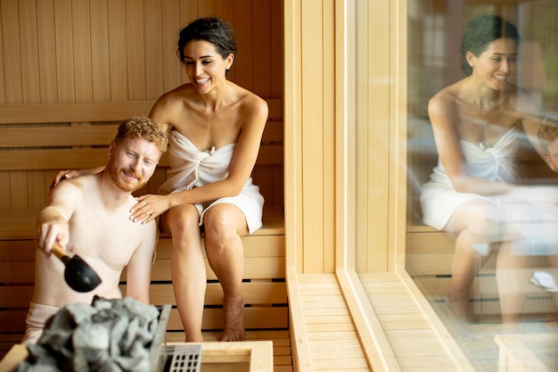 Young couple relaxing in the sauna