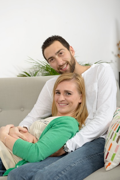 Young couple resting in the sofa