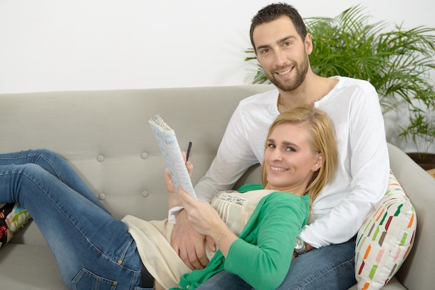 young couple resting in the sofa