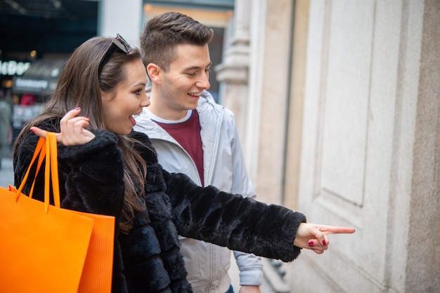 Young couple shopping together in an urban street