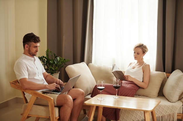 Young couple sitting at home