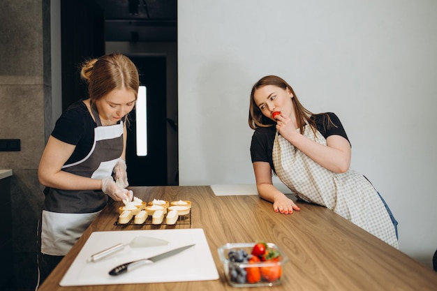 Young couple smiling happy cooking sweets at kitchen