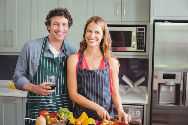 Young couple standing in a kitchen