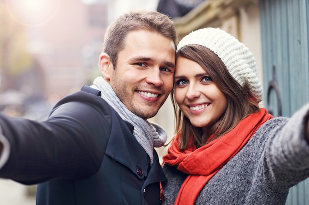 young couple taking selfie in the city