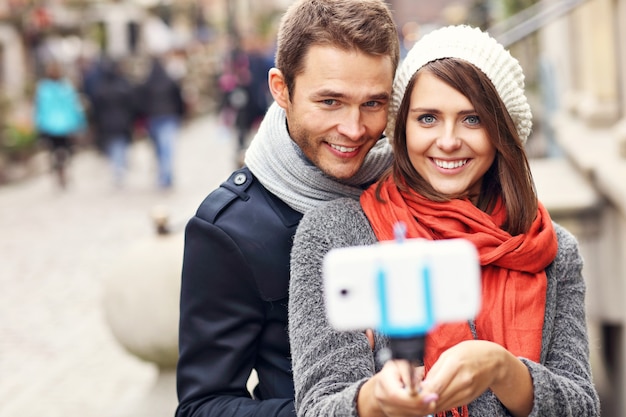 young couple taking selfie in the city