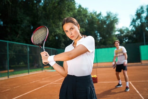 Young couple on a tennis court