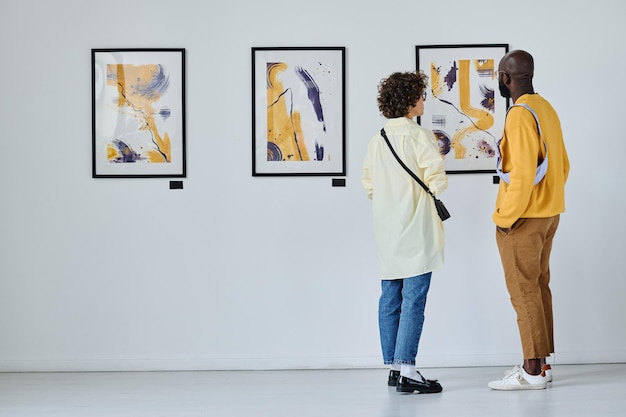 Young couple visiting art gallery