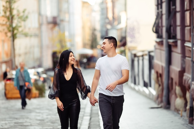 Young couple walking and having fun in the park. Lviv