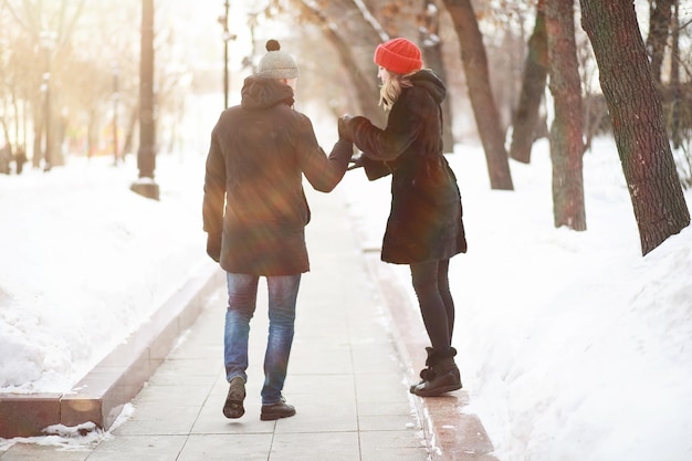 Young couple walking through the winter city