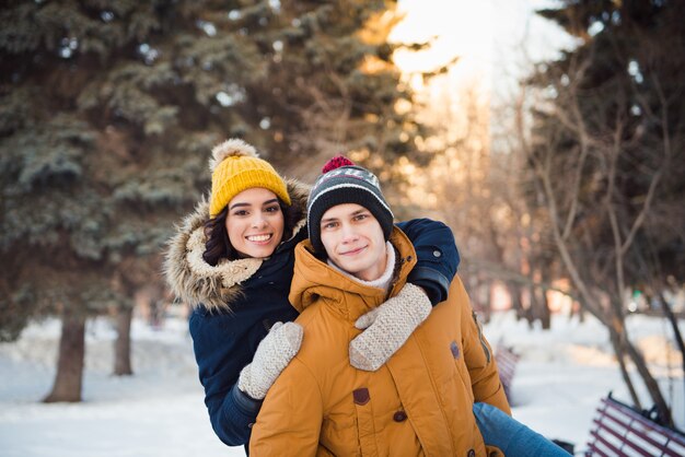 young couple walking winter park