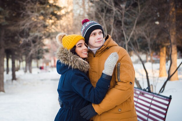 young couple walking winter park