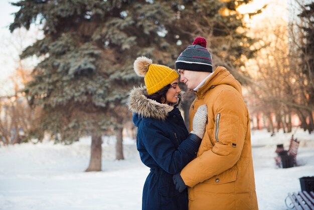 young couple walking winter park