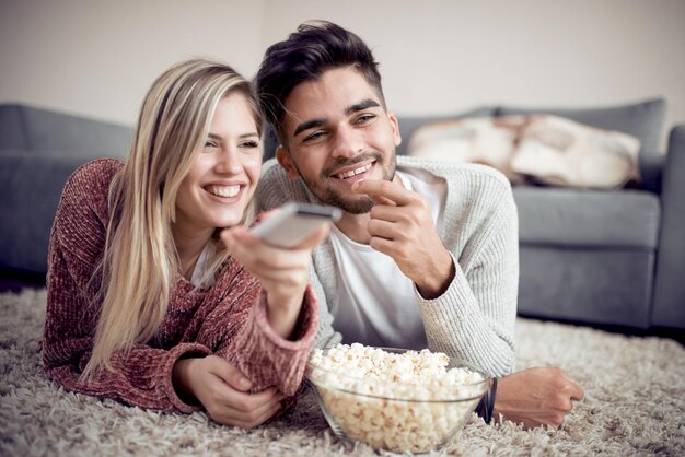 Young couple watch TV