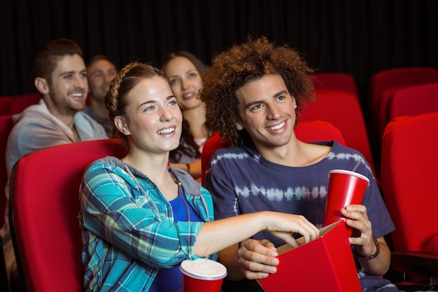 Young couple watching a film