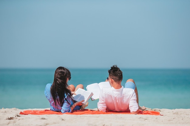 Young couple on white beach during summer vacation