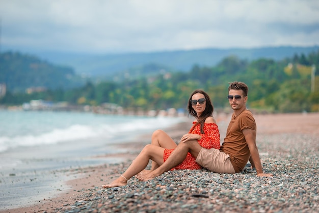 Young couple on white beach during summer vacation