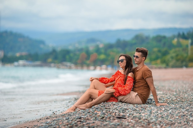 Young couple on white beach during summer vacation